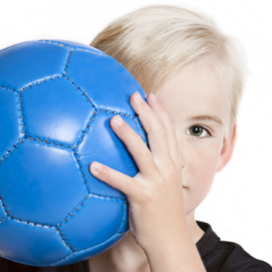 'child with face trauma holding soccer ball'
