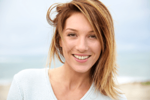 smiling blonde woman at beach