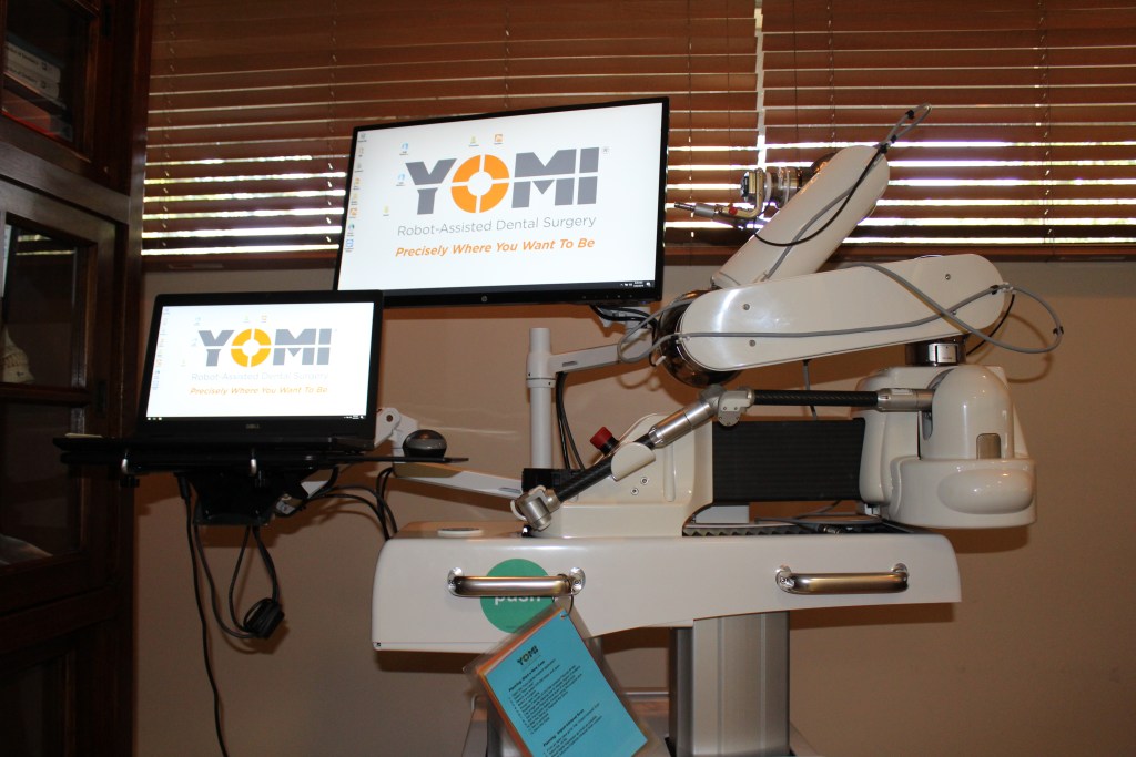 Two monitors with Yomi on the screens